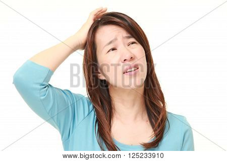 portrait of perplexed woman on white background