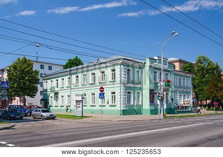 GOMEL BELARUS - JUNE 25 2015: Unidentified people walk down the street Sovetskaya near the Gomel Regional Philharmonic