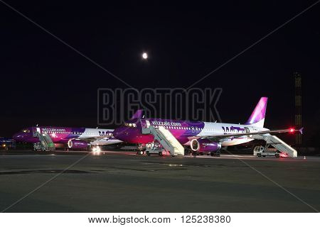 Kiev Ukraine - March 27 2011: Wizz Air Airbus A320 passenger planes being serviced at the airport