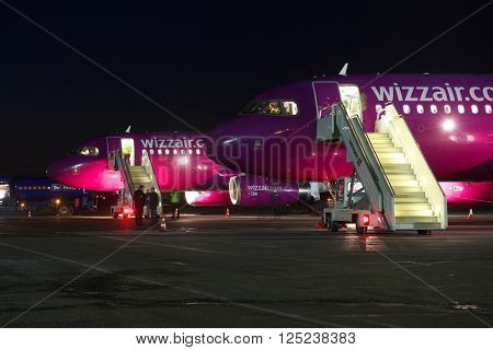 Kiev Ukraine - March 27 2011: Wizz Air Airbus A320 passenger planes at the airport at night close up view