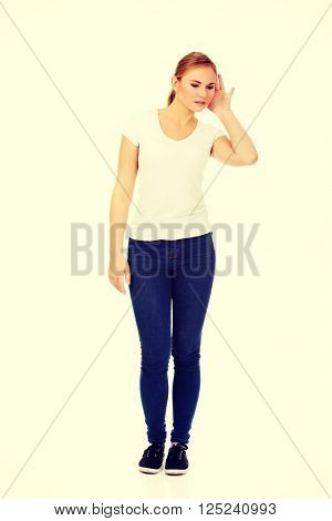Shocked young woman overhears conversation