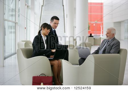 Group of business people meeting in a hall