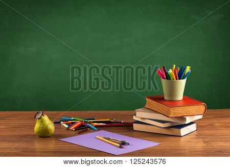 Back to school concepty with clear blackboard background, desk, items