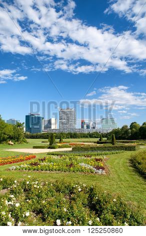 Office buildings in Danube City, Vienna, Austria. Beautiful garden and tree in foreground