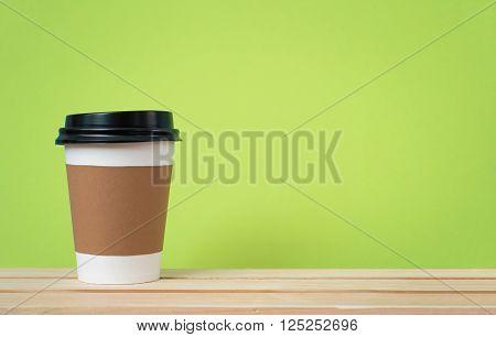 Paper cup with Sleeve on green background