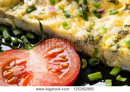 delicious omelette and fresh tomato close up