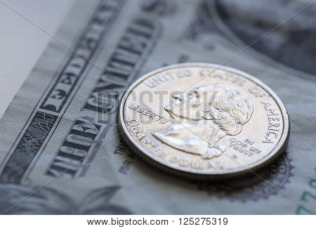 Quarter on US Dollar Bill Close up