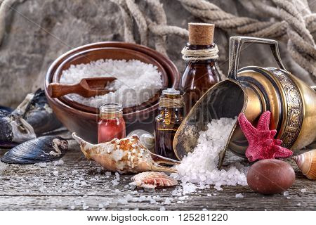 Essential oils and bath salt with a sea shells