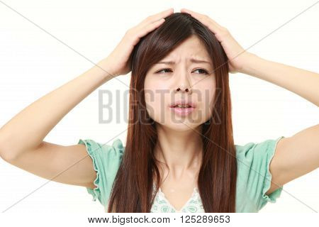 portrait of perplexed woman on white background