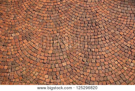 Closeup of brown radial stone pavement texture