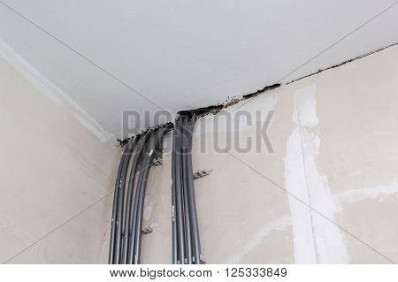 Nine Polyethylene Pipe Goes Between Wall And The Ceiling