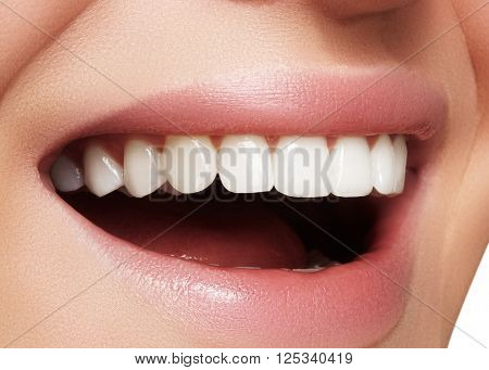 Beautiful smile with whitening teeth. Dental photo. Macro closeup of perfect female mouth, lipscare rutine