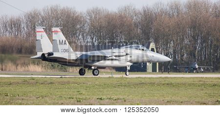 LEEUWARDEN NETHERLANDS - APRIL 11 2016: US Air Force F-15 Eagle takking off during the exercise Frisian Flag. The exercise is considered one of the most important NATO training events this year.