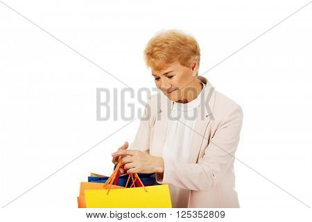 Happy business woman holging shopping bags