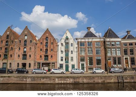 GRONINGEN, NETHERLANDS - APRIL 9, 2016: Warehouses at a canal in Groningen, The Netherlands