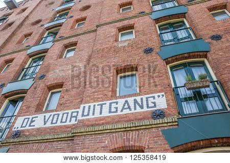 GRONINGEN, NETHERLANDS - APRIL 9, 2016: Detail of an old warehouse at a canal in Groningen, the Netherlands