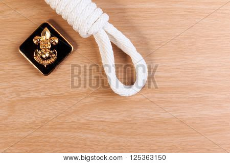 Orderliness White Scout Rope With Vintage Boy Scouts Badge On Wooden Table.