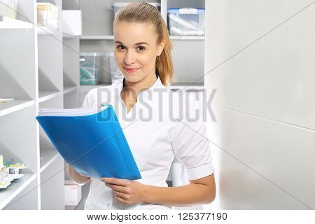 The nurse checks the supply of hospital pharmacy