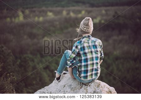 Young woman watching landscape, posing outdoor. Active lifestyle concept. 