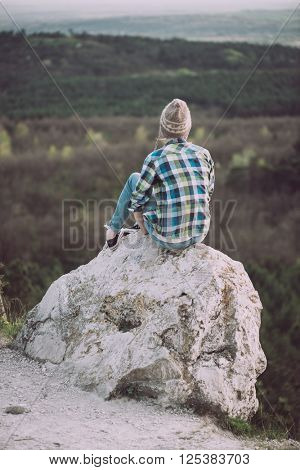 Young woman watching landscape, posing outdoor. Active lifestyle concept. 