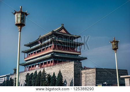 Beijing, China at the Zhengyangmen Gatehouse in Tiananmen Square. Beautiful historical building at sunset.