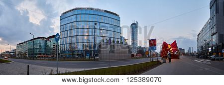 Warsaw, Poland - March 28, 2016: Kasprzaka street, Office building Warsaw Spire under construction in Warsaw, Poland. Warsaw Spire is a modern landmark and a powerful symbol of Warsaws energy.