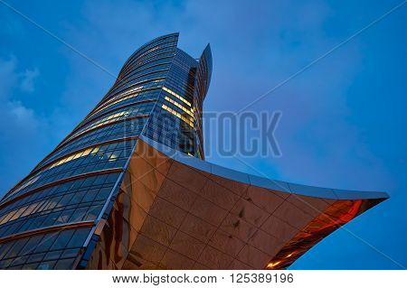 Warsaw, Poland - March 28, 2016: Office building Warsaw Spire under construction in Warsaw, Poland. Warsaw Spire is a modern landmark and a powerful symbol of Warsaws energy.
