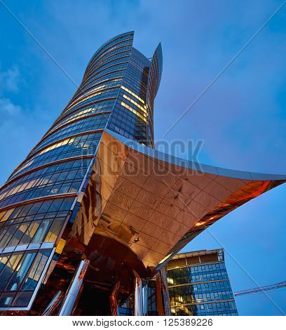 Warsaw, Poland - March 28, 2016: Office building Warsaw Spire under construction in Warsaw, Poland. Warsaw Spire is a modern landmark and a powerful symbol of Warsaws energy.