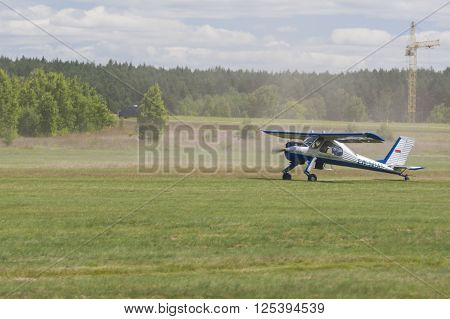 Minsk Belarus-June 21 2014: Airplane PZL 104 Wilga on Takeoff and Landing Strip In Front of Spectators During Aviation Sport Event Dedicated to the 80th Anniversary of DOSAAF Foundation in Minsk on June 21 2014 in Minsk Republic of Belarus