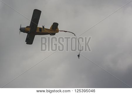 Minsk Belarus-June 21 2014: Parachute Jumpers Performing Air Elements on AN-2 Airplane During Aviation Sport Event Dedicated to the 80th Anniversary of DOSAAF Foundation in Minsk on June 21 2014 in Minsk Republic of Belarus
