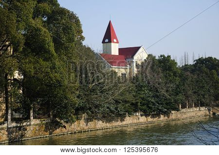 European style building within Chenshan Botanical Garden Shanghai China in the early springtime.