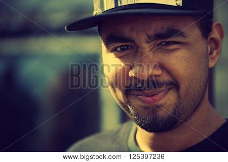 Young African Guy In Cap Smiling
