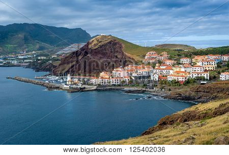 Canical small town, lighthouse and yacht marina view. East coast of Madeira island, Portugal.