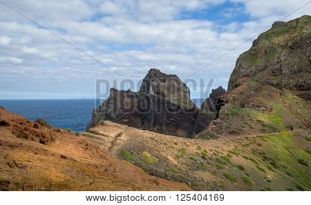 Beautiful hiking path to the astern cape of Madeira islands. Tourists is walking to discover the beauty of Madeira. Portugal.