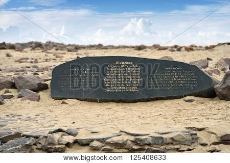 CAPE CROSS NAMIBIA - JAN 31 2016: A memorial stone for Diogo Cao who landed at this spot in 1485 and who erected a stone cross or padrao at this spot