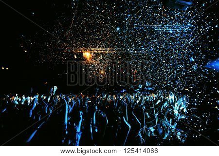 night party concert crowd of people silhouettes hands up