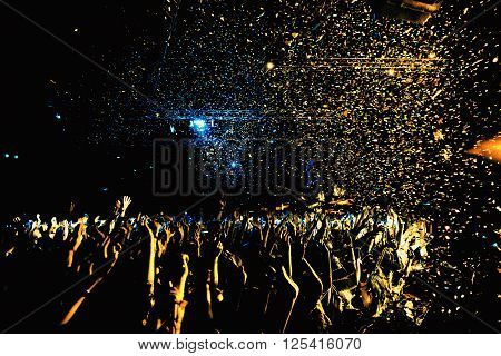 night party concert crowd of people silhouettes hands up