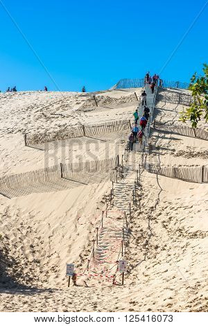 People Visiting The Highest Sand Dune Of Pyla In Europe