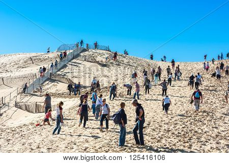 People Visiting The Highest Sand Dune Of Pyla In Europe