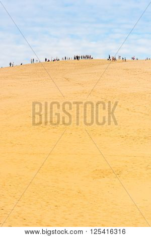 People Visiting The Highest Sand Dune Of Pyla In Europe