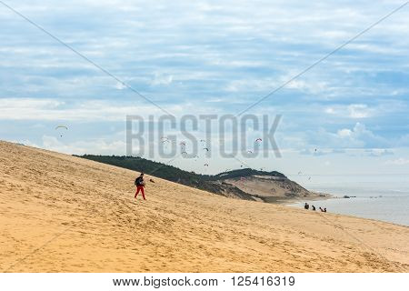 People Visiting The Highest Sand Dune Of Pyla In Europe