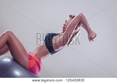 Woman Doing Fitness Exercises With Fit Ball