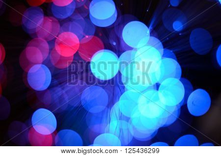Blurred abstract pink and blue bokeh lights. Christmas holiday defocused background. Backdrop for your design