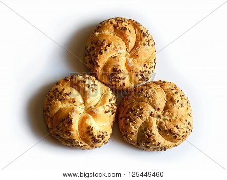 three light buns with seeds on white