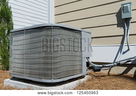 A/C unit connected to the residential house