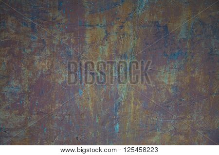 A old wall scratched in multi colors way