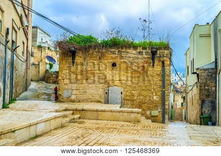 The old abandoned house located in the middle of residential district in old town Nazaret Israel.