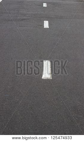 New asphalt texture with white dashed line