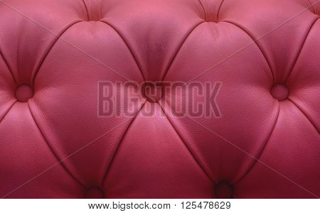 Leather upholstery of a magnificent sofa, pink