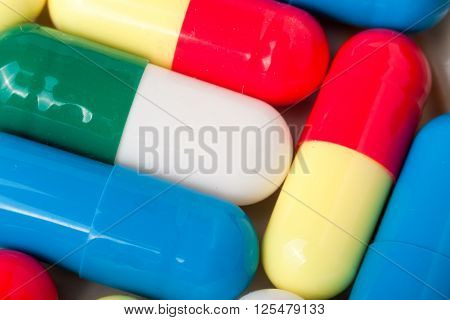 pills capsules as background close up macro.